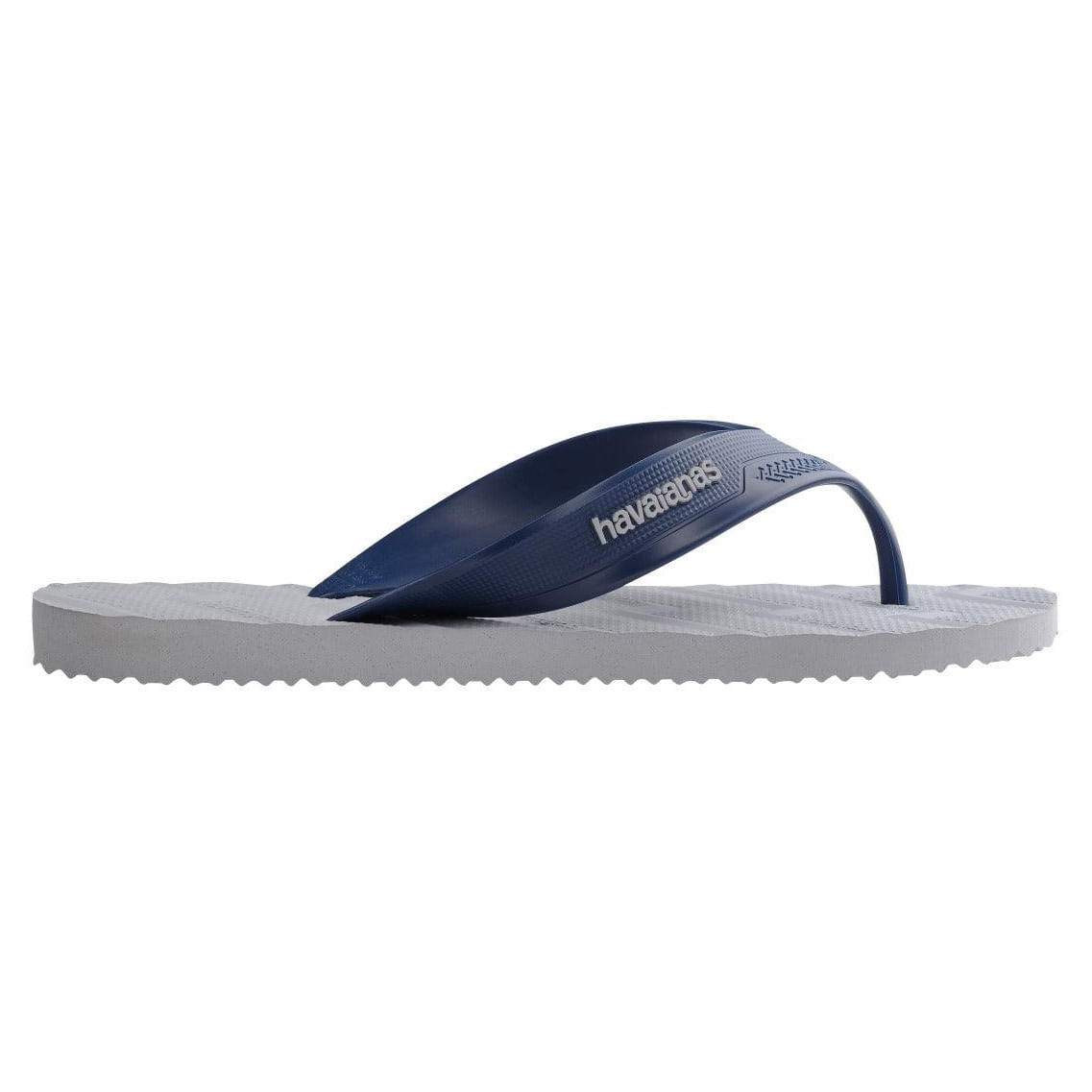 Perfil lateral do chinelo Havaianas Track Waves mostrando espessura do solado cinza gelo e tira azul marinho com logo